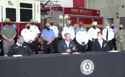 Flanked by members of the Corpus Christi Fire Department, including Chief Robert Rocha (left at table), Gov. Greg Abbott announced a Save our Seniors Initiative to begin statewide on Monday, March 1. The program to vaccinate all Texans ages 65 and older by the end of March is based on the city’s model. Screen-captured image