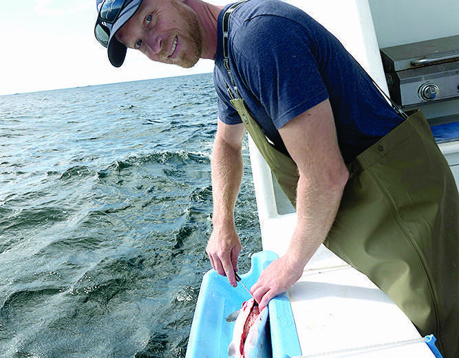 Captain Nick Alvey aboard the Alaskan Adventurer, an 80-foot luxury fishing vessel in Sitka, Alaska. The boat and captain made their way from Port Aransas to Sitka, where Alvey has started a charter fishing business.