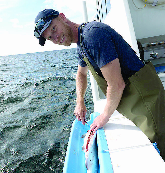 Captain Nick Alvey aboard the Alaskan Adventurer, an 80-foot luxury fishing vessel in Sitka, Alaska. The boat and captain made their way from Port Aransas to Sitka, where Alvey has started a charter fishing business.