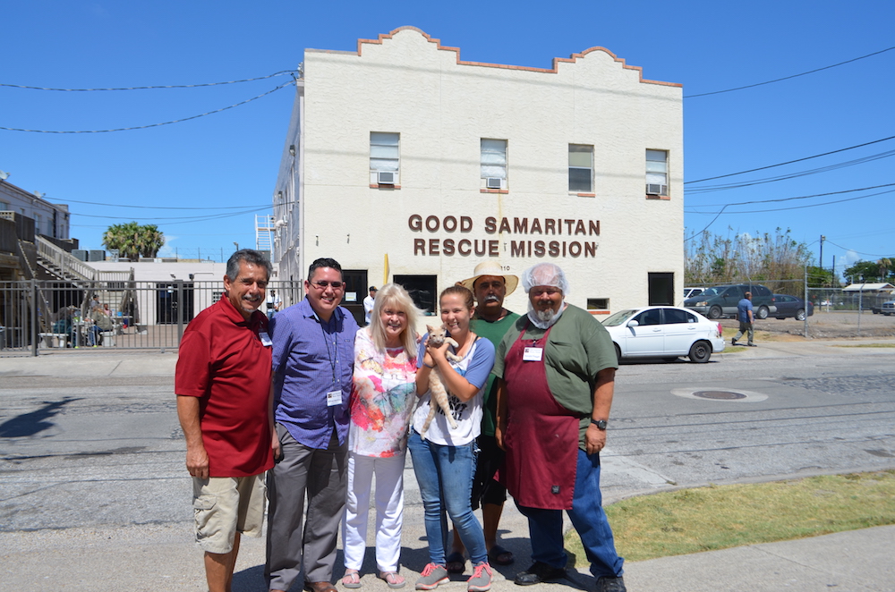 Just a few of the people who help Good Samaritan Rescue Mission run smoothly are George Quintanilla (left), laundry; Alfred Martinez, assistant to director; Carole Murphrey, executive director; Tatiana McCormick, animal care; ‘Gilbert,’ landscape services; and Ronald Plagge, food service. Front and center is Simba, a ginger tabby cat who is both a well-loved board member and a resident. Photo by Jane Kathleen Gregorio