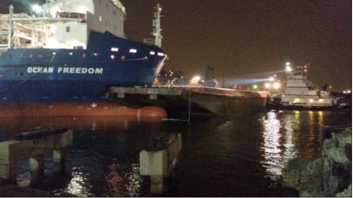 Kirby 8044, am empty barge, lodged into the Ocean Freedom, a 480-foot cargo ship in the inner harbor of the Port of Corpus Christi on Oct. 29. A $300 million capital improvement project would make the ship channel safer, says port commissioners. Photo U.S. Coast Guard