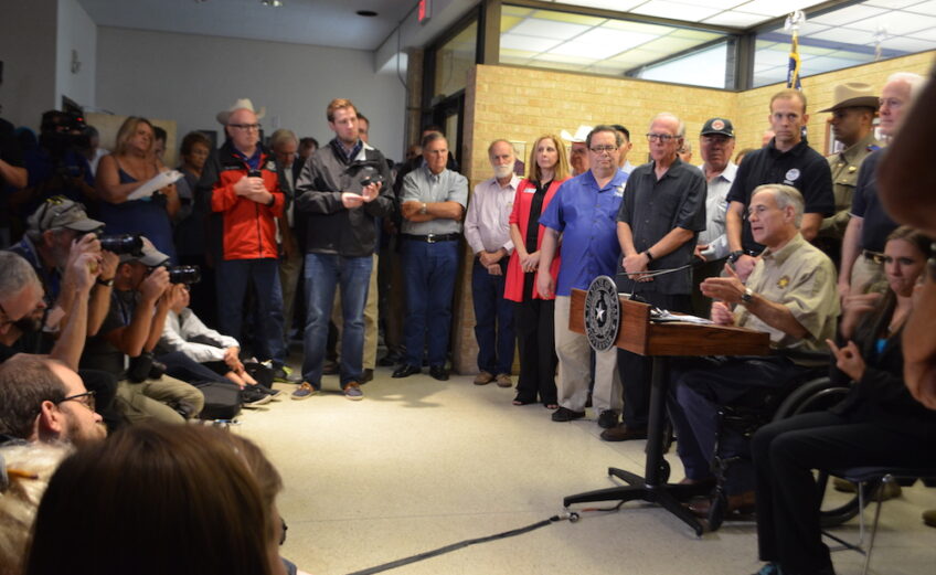 Texas Governor Greg Abbott with U.S. Sen. John Cornyn, U.S. Rep. Blake Farenthold, State Rep. Todd Hunter, State Sen. Chuy Hinojosa and other officials at a news conference Aug. 28, which was followed by a tour of the damage in Rockport. President Donald Trump is expected later today, August 29. Photo by Jane Kathleen Gregorio