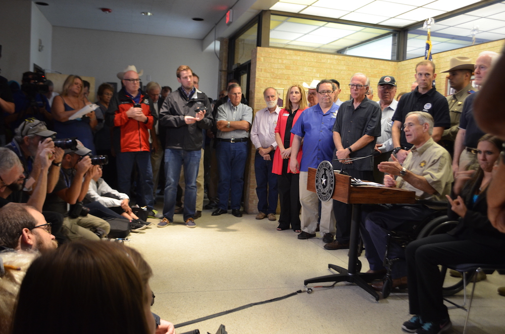 Texas Governor Greg Abbott with U.S. Sen. John Cornyn, U.S. Rep. Blake Farenthold, State Rep. Todd Hunter, State Sen. Chuy Hinojosa and other officials at a news conference Aug. 28, which was followed by a tour of the damage in Rockport. President Donald Trump is expected later today, August 29. Photo by Jane Kathleen Gregorio