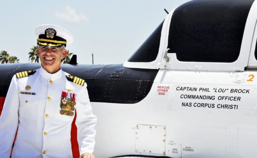 Capt. Philip Brock stands next to the T-34C aircraft that will bear his name throughout his tenure as commanding officer of Naval Air Station Corpus Christi. Brock assumed command of the South Texas naval air station during a change-of-command ceremony July 20. Photo by Jason Kucera, NASCC Public Affairs