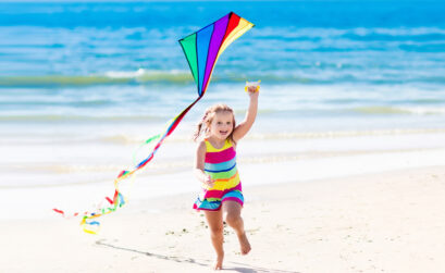 Beach breezes keep kites aloft all year long, at any time of the day. Anyone can hoist a kite to soar along the shoreline in Corpus Christi.