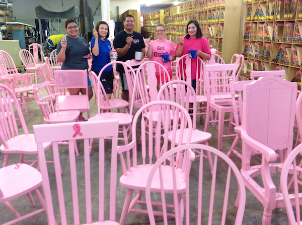 The marketing team from Radiology Associates held several paint parties to turn more than 200 chairs pink as part of the Empty Chair Project for Breast Cancer Awareness Month in October. Putting on the finishing touches — the bright pink ribbons — are (from left) marketing assistant Cindy Alaniz, marketing director Carmen Arias and marketing reps Robert Vasquez, Amy Curry and Isabel Pacils. Photo by Suzanne Freeman