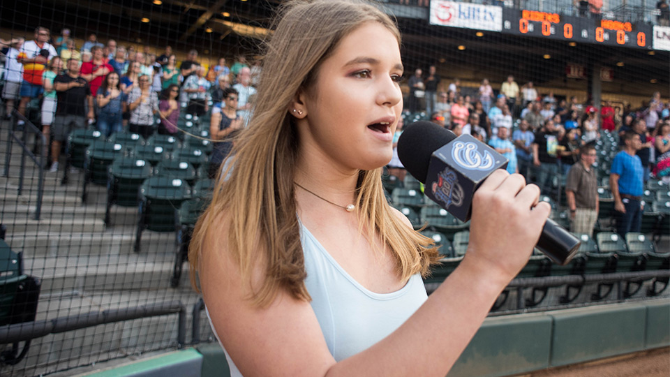 A young singer performs the National Anthem before a Corpus Christi Hooks game at Whataburger Field during a past season. Photo Courtesy Corpus Christi Hooks