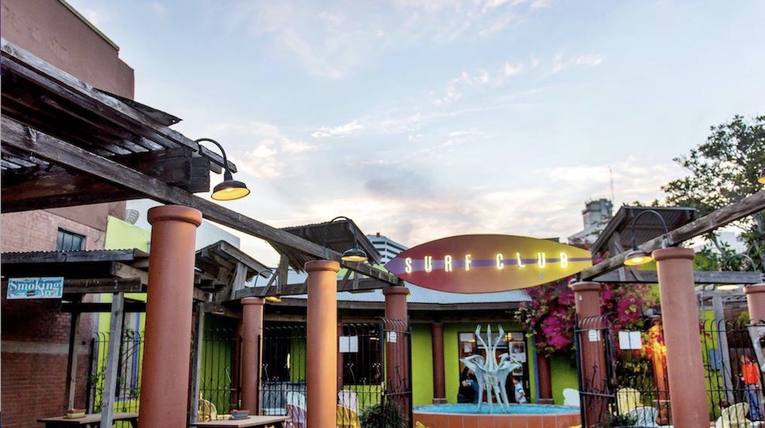 One of several entrances to the Water Street Market area in downtown Corpus Christi, home to the Executive Surf Club (shown), Water Street Oyster Bar, Water Street Sushi Room, South Texas Music Walk of Fame, and Texas Surf Museum. Courtesy image