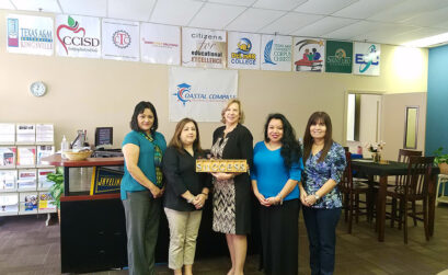 Standing beneath banners representing each of the partners that comprise Coastal Compass are (from left) Irene Martinez, Workforce Solutions; Isabel Salinas, advisor for high school students; Dr. Janet Cunningham, executive director; Victoria Prewitt, coordinator; and Maria Cerda, office assistant. Photo by Jane Kathleen Gregorio