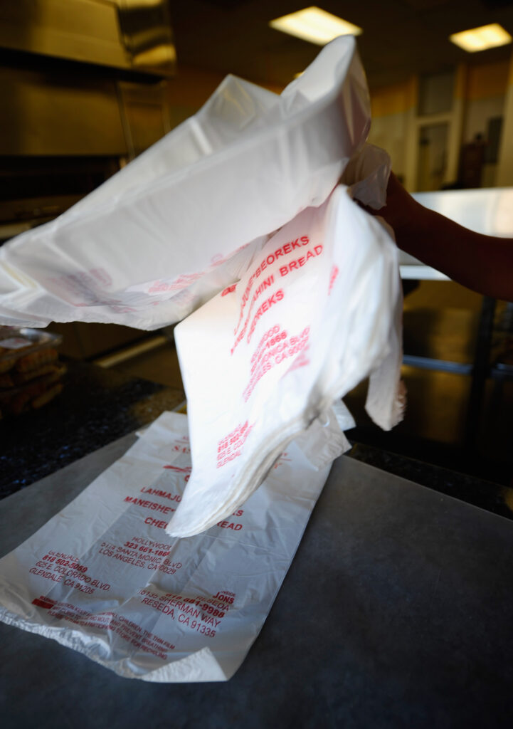 Cities can no longer ban retailers from bagging purchased items in single-use plastic bags. The Texas Supreme Court recently ruled that the Texas Solid Waste Disposal Act preempted any attempts by a municipality to regulate the use of plastic bags. (Photo by Kevork Djansezian/Getty Images)