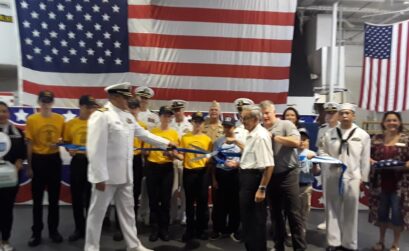 A blue ribbon was cut aboard the USS Lexington Museum on the Bay on Oct. 6 to announce the re-establishment of the U.S. Naval Sea Cadet Corps. The corps is a leadership program for young people ages 10 through high school. Courtesy photo