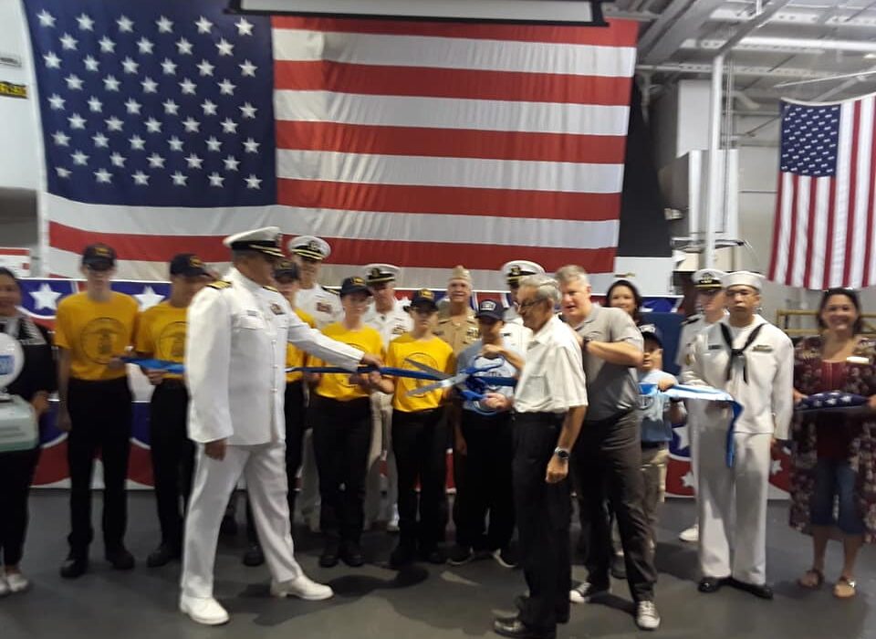 A blue ribbon was cut aboard the USS Lexington Museum on the Bay on Oct. 6 to announce the re-establishment of the U.S. Naval Sea Cadet Corps. The corps is a leadership program for young people ages 10 through high school. Courtesy photo