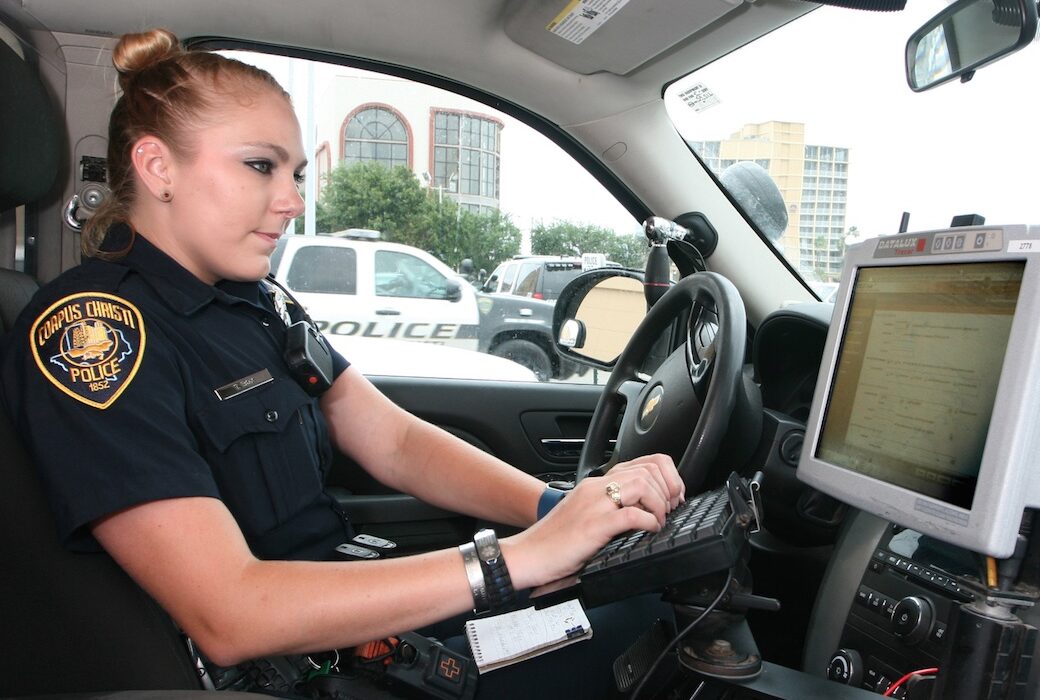 Corpus Christi police officer Tanya Box types in the license plate number and last four digits of the vehicle identification number to generate a crash report. The new Texas Department of Transportation program allows for quick generation of reports for drivers and their insurance companies. Photo by Carrie Robertson Meyer/ Third Coast Photo