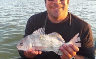 Dr. Matt Ajemain holds a tagged drum about to be released in Baffin Bay. Courtesy Photo
