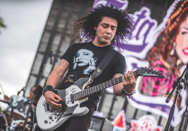 Chris Perez, husband of Selena Quintanilla Perez, plays at Fiesta de la Flor in Corpus Christi. The festival boasts a $15 million economic impact on the city in its second year. Photo by Jason Page