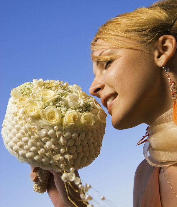 Shells, pearls and white roses make for the perfect sea side wedding bouquet.