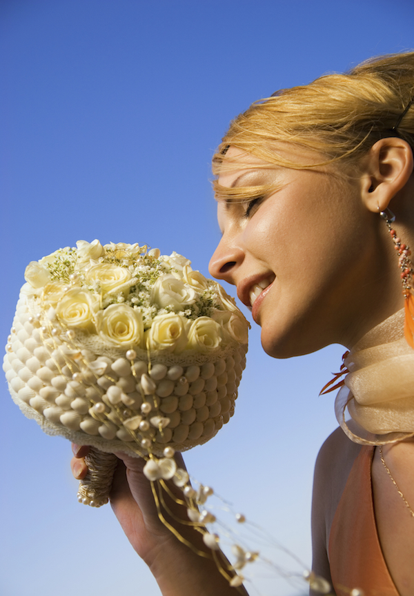 Shells, pearls and white roses make for the perfect sea side wedding bouquet.