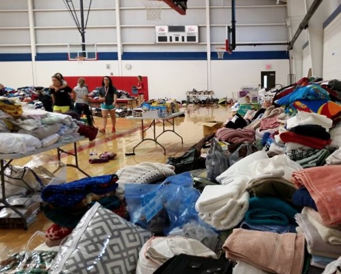 Donations pile up in the Wimberley High School gymnasium after deadly floods over Memorial Day weekend. Photo courtesy Barnabas Connection