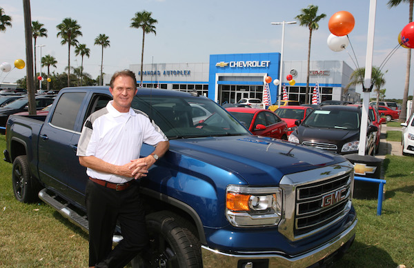 Greg Barton, general manager of Aransas Autoplex in Aransas Pass, with one of his top selling vehicles: the good ol’ Texas Truck! Photo by Carrie Robertson Meyer/Third Coast Photo