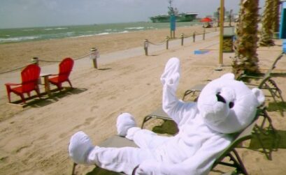 Frio the Bear, mascot for the New Year's Day Polar Bear Plunge, soaks up the rays on North Beach in Corpus Christi. The plunge begins at noon in front of Fajitaville Restaurant, Jan. 1, to raise money for ALS research. Courtesy Photo
