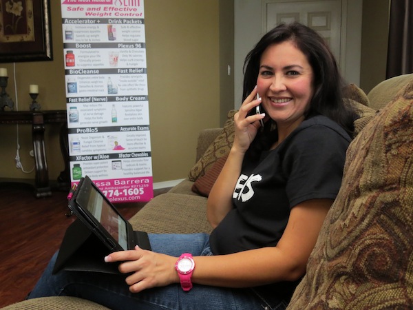 Working from home selling a weight loss product allows Melissa Barrera to conduct business via smartphone, tablet and couch. An office attire of blue jeans and T-shirt doesn't hurt either, says Barrera, who quit a full-time job in a law firm to start her own business. Staff photo